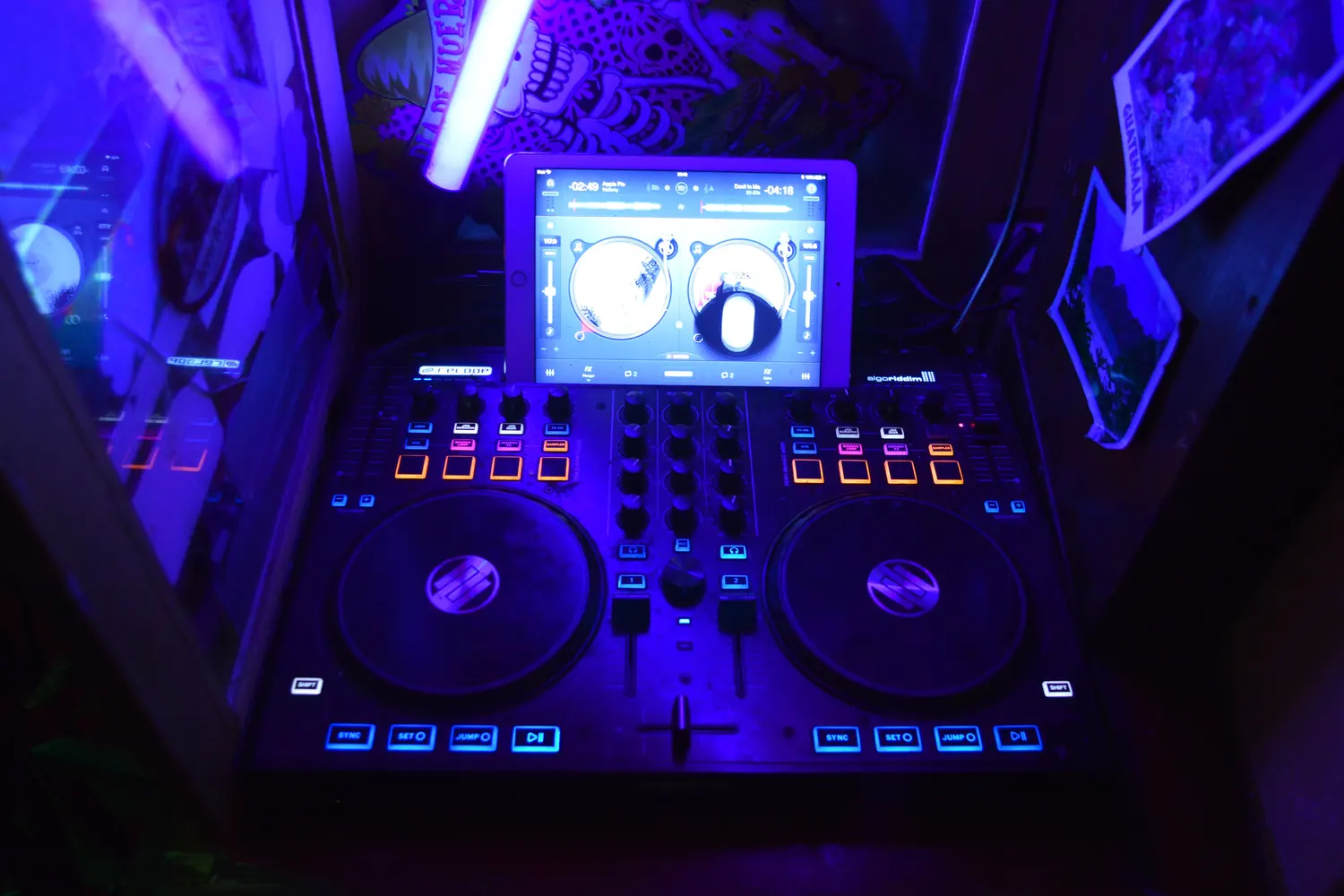 The DJ desk in the blue light of the back room