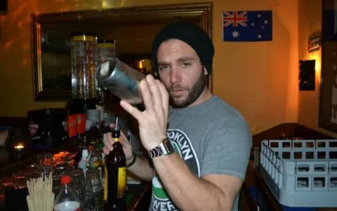 Romano Göldi mixes a drink behind the counter of Bar LaOnda